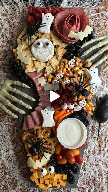 Kassie / Georgia Girl on Instagram: "This is one of my favorite charcuterie boards ever!  I found most of the items (skeleton hands, mouse, spiders, and spider webs) at Dollar General for a couple of bucks each, and I used a bat cookie cutter to make the bat cheese and gum balls for the eyeballs. I made the coffin charcuterie board but I found some you can purchase as well. Just add on all your favorite snacks and you have the perfect spooky coffin charcuterie board!   Comment “coffin” and I’ll direct DM you all the links to my your own spooktacular coffin charcuterie board!   #spookyseason #halloween #halloweentreats #diy #diycharcuterieboard #charcuterieboard #coffincharcuterieboard #halloweenfood #snacks #partyideas #halloweencountdown #fallfood" Coffin Shaped Charcuterie Board, Halloween Charcuterie Boards, Halloween Hand Cheese Board, Skeleton Charcuterie Board, Coffin Charcuterie Board, Spooky Charcuterie Board Skeleton, Halloween Charcuterie Board Scream, Halloween Charcuterie, Cornbread Cupcakes