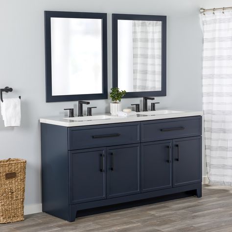 Transform your bathroom with the Potter 60.5-in W deep blue vanity. This double-sink bathroom vanity features a Shaker-style design that’s complemented by a 1-piece white cultured marble sink top and matte black hardware. Pre-assembled and ready to install, this vanity also includes a wraparound drawer with 3 compartments and a 2-door cabinet below each sink for easy-access storage space. This transitional vanity adds style and storage in large and shared bathrooms. Style Selections Potter 60-in Blue Double Sink Bathroom Vanity with White Cultured Marble Top | LW24W60P2-DB Blue Double Sink Bathroom Vanity, Blue Bathroom Vanity With Black Hardware, Navy Vanity With Black Hardware, Bathroom Cabinet Navy, 49 Inch Bathroom Vanity, Dark Blue Bathroom Vanity Ideas, Navy Blue Cabinets With Black Hardware, Blue Sink Bathroom Ideas, Navy Blue And Grey Bathroom Ideas