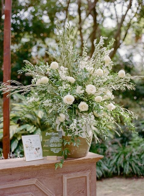 Wedding Bar Arrangement, Bar Floral Arrangement, Bar Flowers, Olive Branch Wedding, Bar Wedding Reception, Wedding Cheers, White Flower Arrangements, White Bar, Reception Design