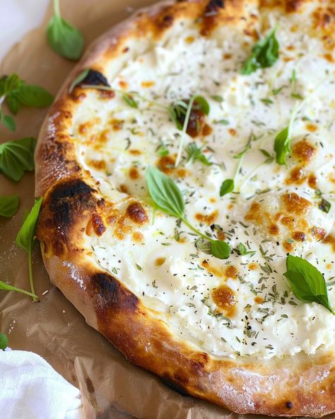 Garlicky White Pizza with Mozzarella and Ricotta If you’re a pizza lover and enjoy experimenting with new flavors, this Garlicky White Pizza with Mozzarella and Ricotta is a must-try. It’s ... Read more White Pizza With Zucchini, Ricotta Pizza Ideas, Homemade Pizza With Fresh Mozzarella, Zucchini Ricotta Pizza, Chicken Ricotta Pizza, Pesto Ricotta Pizza, White Pizza With Ricotta Cheese, Ricotta On Pizza, Ricotta Pizza Sauce