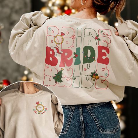 Custom Bride Christmas Sweatshirt, Christmas Bride Shirt, Bridal Shower Gift, Christmas Bachelorette Shirt, Wedding Gift, Engagement Gift Note: For Different Color From Colors List Please "Message us or leave a note" MATERIAL UNISEX T-SHIRT - Medium fabric (5.3 oz/yd² (180 g/m - Classic fit - Runs true to size - 100% cotton (fiber content may vary for different colors) - Tear-away label UNISEX SIZING CHART Small: Length 28" - Width 18" (4-6) Medium: Length 29" - Width 20" (6-10) Large: Length 30" - Width 22" (10-14) XL: Length 31" - Width 24" (14-18) 2XL: Length 32" - Width 26" (18-20) 3XL: Length 33" - Width 28" (20-22) All measurements are approximations. Shirts may be within 1" of the dimensions listed The shirts were measured laying on a flat surface, side to side and top to bottom. HO Christmas Bachelorette Party, Christmas Bachelorette, Christmas Bride, Bachelorette Ideas, Bachelorette Shirt, Bride Shirt, Bride Shirts, Bachelorette Shirts, Bridal Shower Gift