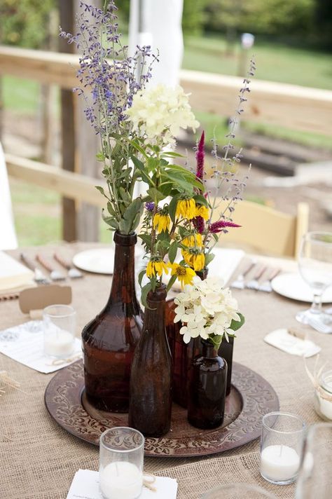 beer bottle centerpieces | brown bottle centerpieces- not the right colors, but what about a ... Beer Bottle Centerpieces, Mini Wine Bottle Favors, Bottle Centerpieces, Mini Wine Bottles, Barn Parties, Jar Centerpieces, Brown Bottles, Wedding Bottles, Amber Bottles