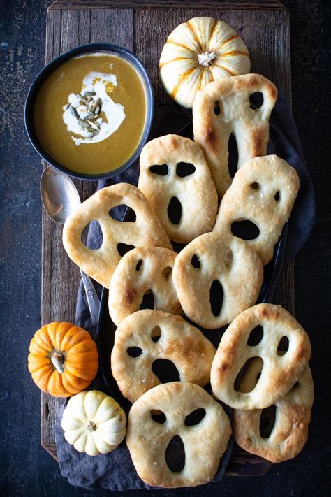 Fun No-knead Ghost Fougasse for Halloween made with easy no-knead dough.  These fun ghost-shaped fougasses are crisp on the outside and soft on the inside.  This dough is very similar to the no-knead crusty bread dough but it has the addition of a bit of sugar and olive oil.  I think you're going to love how fast and easy this recipe is.  Perfect for dunking into a warming cup of soup on a chilly night. #nokneadough #crustybread #halloween #simplysogood Recetas Halloween, Fun Halloween Treats, Cup Of Soup, Holiday Sweets, Spooky Food, Halloween Recipe, Halloween Dinner, No Knead, Halloween Snacks