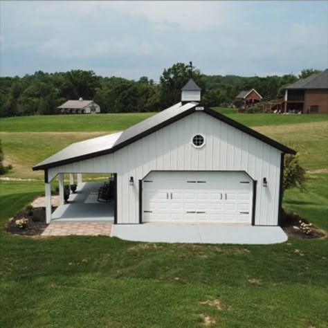 This 24' x 30' Pole Barn Garage is our most popular project. This garage makes a perfect addition to any country lot. The post frame design ensures a long-lasting addition to your estate and our steel panels ensure lifelong beauty with minimal maintenance. Whether it is used for storage or insulated for a workshop, she-shed or man-cave, this backyard garage is sure to please any homeowner. Click on the link to see the current price. 30 X 30 Garage Plans, 24x30 Garage Plans, Pole Barn Garage Interior, Pole Barn With Porch, 30x40 Pole Barn Garage, White Pole Barn, Backyard Garage Ideas, 24x30 Garage, 30x40 Garage