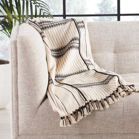 Handmade by weavers in Nagaland, India, the Nagaland collection showcases the traditional loin-loom techniques of the indigenous tribes of the region. The artisan-made Saramati throw effortlessly combines heritage-rich tribal patterns with a versatile, contemporary colorway for a stunning statement in any space. Crafted of soft, finely woven cotton, this classic blanket brings the global art of Naga textiles to the modern home.Collection: Nagaland ThrowSize: 42"x72"Content: 100% CottonOrigin: In Handwoven Throw, Decorative Throws Blanket, Black Throws, Indigenous Tribes, Black Tones, Make Blanket, Construction Crafts, Jaipur Living, Cotton Throw