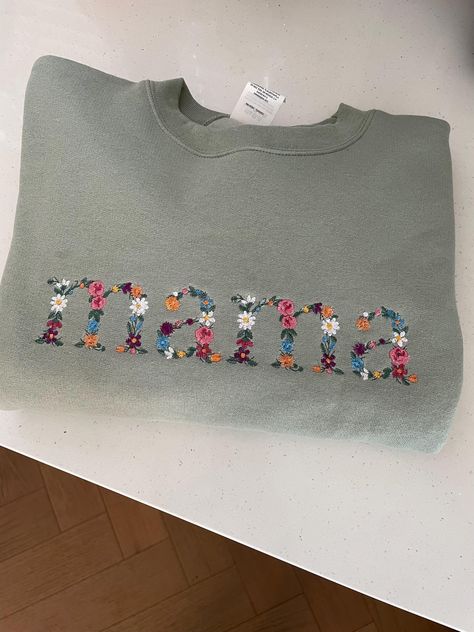 Announce to grandma that you're expecting with this personalized crewneck sweatshirt! Embroidered with the cutest floral font Available in sizes small-2x The perfect gift 8.5 oz./yd² (US) 14.1 oz./L yd, (CA), 80/20 cotton/polyester blend fleece *lowercase letters only Navy Blue Crewneck, Floral Font, Blue Crewneck, Line Art Design, Floral Letters, Lowercase A, Lower Case Letters, Mother's Day Gift, The Cutest