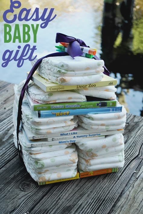 Need an easy and fast idea for a baby shower gift? Create this books and diaper tower using ribbon, diapers, and DVDs. No need to wrap this one! Diaper Tower, Diaper Gifts, Presente Diy, Boy Baby Shower Ideas, Baby Gift Ideas, Create This Book, Diy Baby Shower Gifts, Diy Baby Gifts, Single Pearl