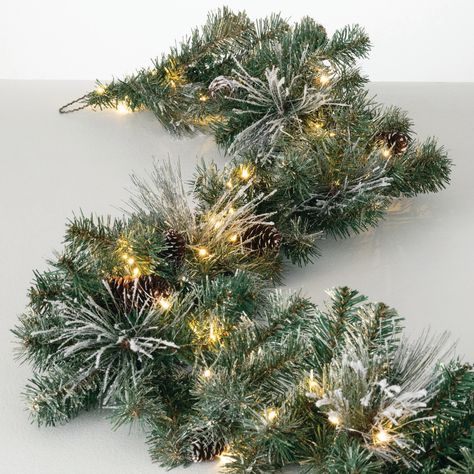 PRICES MAY VARY. Elegant Flocked Pine Garland With Gold Accents: Enhance your Christmas decor with our 9' Artificial Flocked Pine Garland. This stunning Christmas garland features lifelike, snow-frosted pine needles, natural pinecones, gold glittered accents, and lights creating a festive and wintry look perfect for any holiday setting. Prelit with Warm White LED Twinkle Lights: Illuminate your indoor Christmas decorations with this lighted garland. Prelit with warm, white LED lights, it casts a Framing Doorway, Pinecone Garland, Artificial Christmas Garland, Christmas Decorations Garland, Warm White Led Lights, Pine Garland, Artificial Garland, Artificial Flowers And Plants, Christmas Arrangements