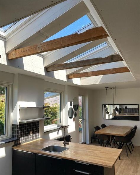 The VELUX® Group on Instagram: "Take a step up from the ordinary and into this wonderfully unique kitchen. 🏠 With its exposed wooden beams and a row of roof windows, this stunning scene is drenched in daylight and enriched with a warm, homey feel. 📷 by @klyverbyg" Kitchen Roof Window, Sky Lights In Kitchen, Velux Kitchen, Roof Windows Skylight, Velux Windows Kitchen, Velux Skylights Kitchen, Kitchen Skylights, Narrow Kitchens, Kitchen Beams