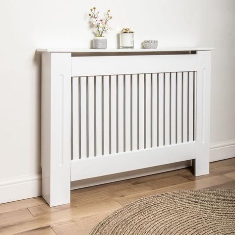 ♡Cover your unsightly radiator with this white radiator cover♡Create extra space with the storage shelf on top of the radiator cover♡Vertical Vents and 1 large top vents optimal heat distribution♡Skirting board cut out to sit flush against any wall♡Some assembly required, wall brackets included♡Small Size: External H- 82cm W- 112cm D- 19cm Internal - H- 80cm W- 104cm D- 17cm♡Large Size: External H- 82cm W- 152cm D- 19cm Internal - H- 80cm W- 142cm D- 17cm♡Adjustable Size: External -H 80.5cm W- 1 Modern Radiator Cover, Diy Radiator Cover, White Radiator, White Radiator Covers, Best Radiators, Radiator Shelf, Mdf Cabinets, Heater Cover, Hallway Designs