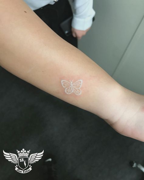 nice 25 Aesthetic White Tattoos White Butterfly Tatoos, White Ink Tattoo Butterfly, White Ink Butterfly Tattoo Small, Small White Butterfly Tattoo, Butterfly Tattoo White, White Ink Butterfly Tattoo, White Finger Tattoos, Feminine Wrist Tattoos, White Butterfly Tattoo