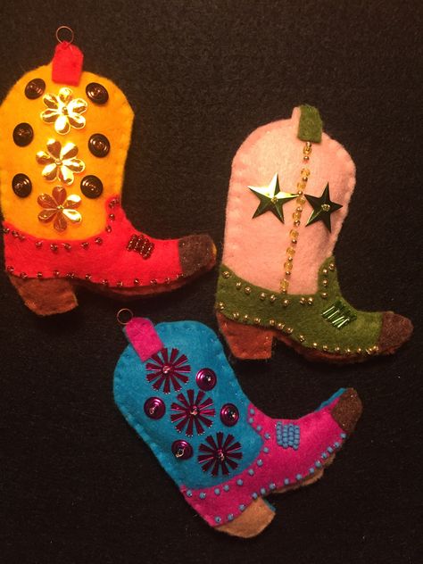 Felt Cowboy Boot ornaments Felt Cowboy Boot Ornament, Cowboy Diy Decor, Cowboy Boot Ornaments, Winter Felt Crafts, Cowboy Boot Stocking, Cowboy Boot Embroidery, Western Ornaments Diy, Diy Cowboy Boots, Cowboy Ornaments