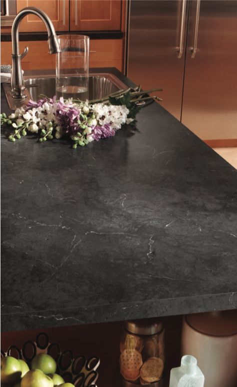 The Black Alicante HPL (High-Pressure Laminate) from Wilsonart’s Marble series featured on this countertop is a perfect subtle dark design for any kitchen or bath design🖤 #modernkitchen #hpl #wilsonart Catani Cabinets is proud to have Wilsonart as one of the suppliers of the high-quality materials we are dedicated to using in every Catani remodel. Learn more about how we revitalize kitchens and baths by checking out our YouTube channel below! 👇 Dekton Countertops Black, Dark Countertops Laminate, Black Marble Laminate Countertops, Black Concrete Countertops White Cabinets, Black Alicante Laminate Countertops, Dark Laminate Countertops With White Cabinets, Black Laminate Countertops Kitchen, Dark Formica Countertops, Dark Corian Countertops