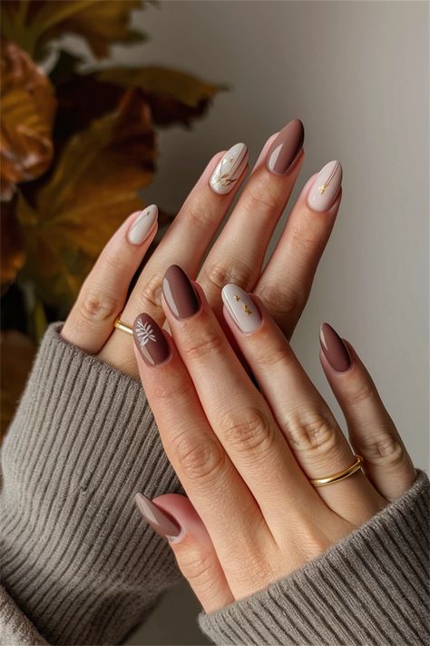 Discover the charm of autumn with these simple nail ideas that capture the essence of Fall. Picture a soft, nude base adorned with delicate golden leaves or cozy plaid patterns in warm hues. This chic yet understated style is perfect for transitioning into the cooler months, offering a blend of elegance and comfort. Whether you're sipping pumpkin spice lattes or enjoying crisp walks through colorful foliage, these nails will match your Fall vibe beautifully! Autumn Transition Nails, Fall Nails Oval Shape, Autumn Colors Nails, Soft Autumn Nails, Autumn Nails Ideas Simple, Brown Neutral Nails, Nude Autumn Nails, Autumn Nails Inspiration, Nail Colors Pastel