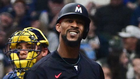 Twins' Byron Buxton nearly collides with bratwurst mascot during game vs Brewers Byron Buxton, Christian Yelich, Health World, Sport Icon, Play Baseball, The Outfield, Bratwurst, Milwaukee Brewers, Minnesota Twins