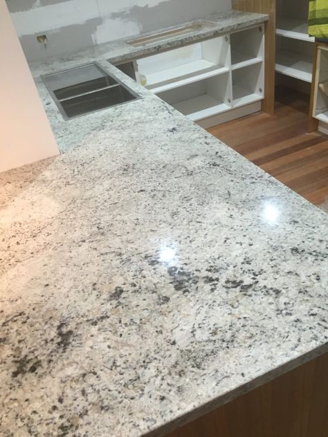 Bianco Romano Granite Benchtop Bianco Romano Granite, Carrera Marble Kitchen, Marble Projects, Granite Benchtop, Marble Kitchen Decor, Carrara Marble Kitchen, Grey Marble Kitchen, Marble Kitchen Counters, Carara Marble