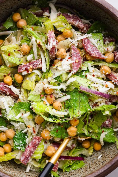 Fresh and flavorful, La Scala Salad is a copycat recipe of the famous Italian chopped salad served at La Scala restaurant in Beverly Hills. Rumor has it, Kim Kardashian orders this salad often, and for good reason! It's packed with delicious ingredients and crunchy texture, thanks to the chickpeas, salami, mozzarella cheese, and a zesty red wine vinaigrette. La Scala Bean Salad, Chickpea Grinder Salad, Cpk Salad, Kardashian Salad Recipe, Salad Recipe With Chickpeas, La Scala Salad, Kardashian Salad, Scala Salad, Kardashian Salads