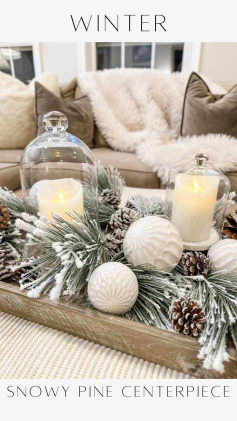 Janine Graff | Snowy Pine Centerpiece ❄️captures the essence of the winter season. I adore the soft glow of candlelight. It’s a challenge to maintain that... | Instagram Snowy Centerpiece Ideas, Winter Decor Centerpiece, Simple Winter Table Centerpieces, Winter Candle Centerpieces, Snowman Centerpiece Ideas, Winter Wonderland Centerpieces Diy, Winter Baby Shower Centerpieces, Winter Floral Arrangements Centerpieces, Winter Dining Table Decor