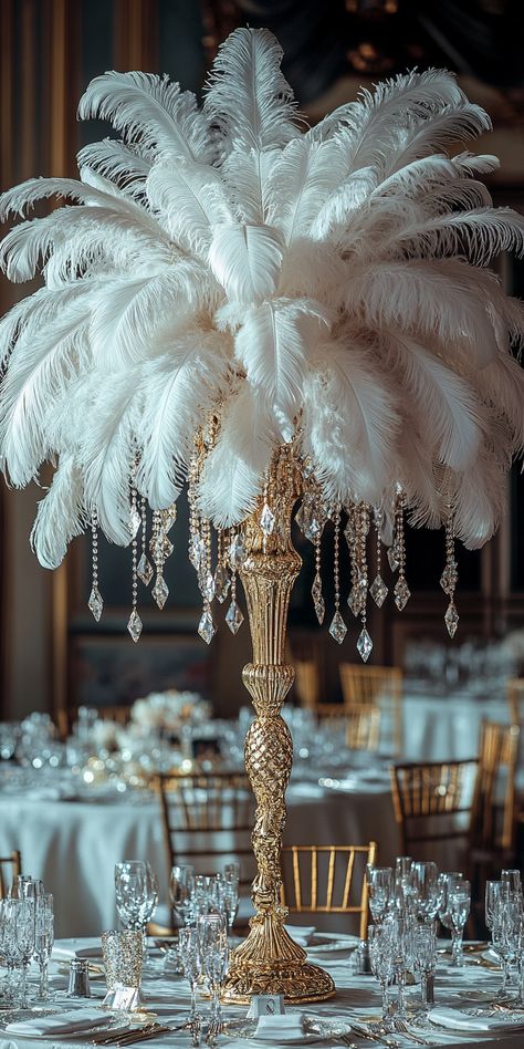 16 Tall Wedding Centerpieces That Are Simple Yet Classy Wedding Centerpieces Feathers, Eiffel Tower Vase Centerpieces Diy, Great Gatsby Dinner Table, Tall Crystal Centerpieces, 1960s Centerpiece Ideas, Aesthetic Wedding Centerpieces, Wedding Centerpieces With Pearls, Great Gatsby Wedding Decor, Masquerade Diy Decorations