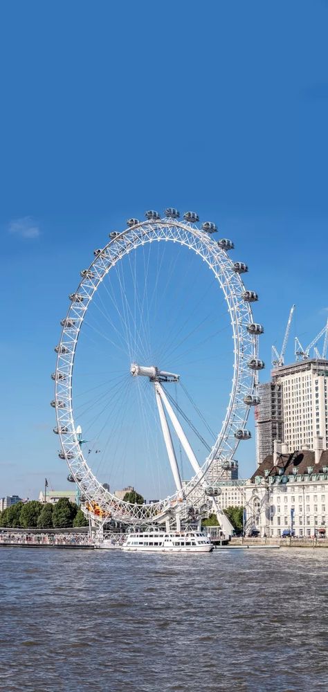 Beautiful ferries wheel ride London Eye (UK 135m) The London Eye is a giant ferris wheel carnivals rides on the south bank of the river Thames in London. The structure is 135m tall and the ferris wheel rides has a diameter of 120m. There are 32 capsules in total, each capsule can bear 25 visitors. The unceasing rotating London Eye has created a great profit for London tourist trade, undoubtedly the top tourist spot in #London. London Ferris Wheel, Night Landscape Photography, London Tourist, The London Eye, Carnival Rides, Manifestation Miracle, Travel Wallpaper, South Bank, Night Landscape