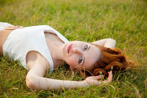 Photo of beautiful young woman lying in the field and relaxing. Beautiful young , #sponsored, #young, #woman, #Photo, #beautiful, #relaxing #ad Head Lying Down Reference, Laying Down Perspective Drawing, Lay Down Pose Drawings, Woman Laying Down Drawing Pose Reference, Irene Rudnyk Photography, Person Lying On The Floor Reference, Woman Reaching Out Reference, Female Laying Down Pose, Lying On The Ground Reference