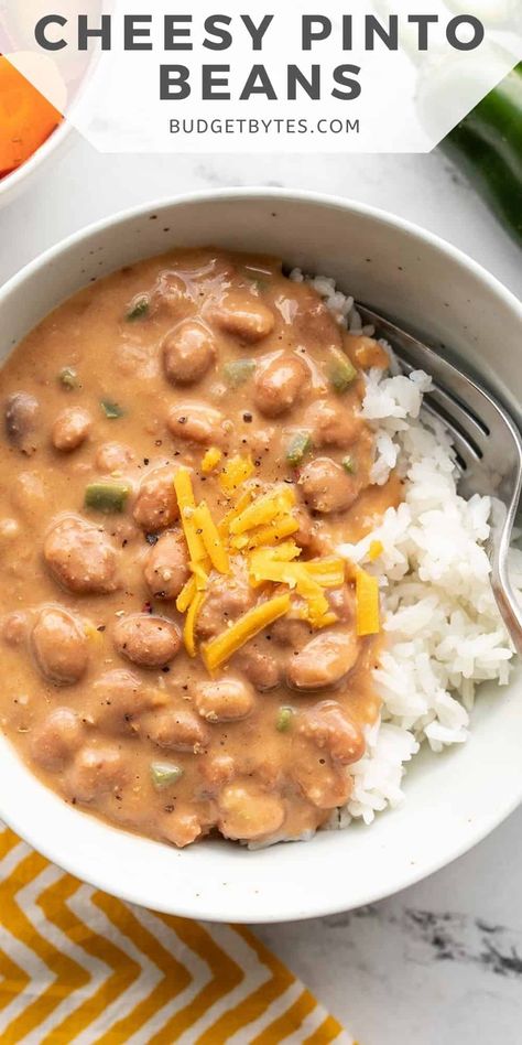 Cheesy Pinto Beans are a quick and satisfying meal made with simple pantry staple ingredients, like canned beans. Cheesy Pinto Beans, Pinto Bean Recipes, Simple Pantry, Budget Bytes, Beans And Rice, Canned Beans, Beef Recipe, Pinto Beans, Meatless Meals