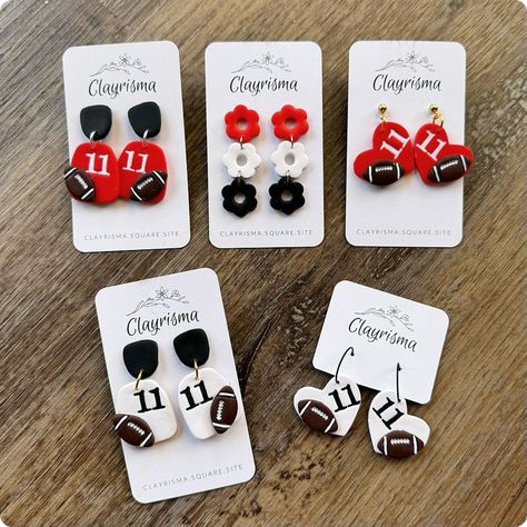 I am now taking orders on these super cute and customizable Game Day Earrings!🤩🏈 Head to my website to customize yours today!✨ • • • #gamedayoutfit #gamedayaccessories #gamedayearrings #footballearrings #fangear #polymerclayearrings #clayesrrings #polymerclaycreations #footballclayearrings #handmadeearrings #custommade #customearrings #customsportswear #customfootballearrings #customfangear #teamspiritaccessories #polymerclayfootballearrings #mamaowned #shopsmall Sport Clay Earrings, School Spirit Clay Earrings, Sporting Clays, Entrepreneur Ideas, Football Earrings, Polymer Earrings, Custom Fans, Cute Polymer Clay, Custom Football