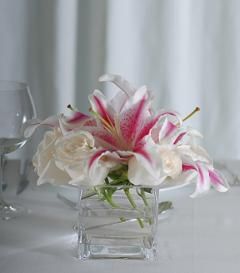 Centerpiece White Rose Centerpiece, Stargazer Lily Wedding, White Rose Centerpieces, Stargazer Lilly, Lily Centerpieces, Rose Centerpiece, Fashion Designer Clothes, Pink Lillies, Rose Centerpieces