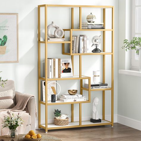 PRICES MAY VARY. Outstanding Design: Especially designed with a golden frame, this chic bookcase blends well with streamlined minimalism and modern style. It is perfect for a simple and modern home decorating style. Its luxurious yet elegant look and simple structure make it a fashionable and functional fit in any room Solid Construction: The etagere bookcase is constructed of durable white faux marble veneer laminate top with a scratch and stain-resistant finish, allowing you to easily clean it Tribesigns Bookshelf, Open Book Shelves, Open Book Shelf, Step Bookcase, Gold Bookshelf, California Chic, Shelves Display, Gold Shelves, Open Bookshelves