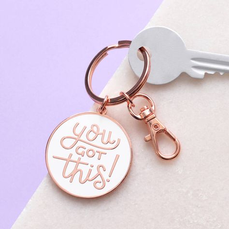 You got this. No matter what the situation, with this keyring to hand you can handle anything! A lovely shiny keychain, featuring our hand drawn 'You Got This' design. Made from white hard enamel and copper toned metal. Complete with keyring and an extra clip, perfect for attaching to bags, backpacks or whatever you fancy adding some charm to! Supplied on an illustrated recycled card backing board. Made in the UK. A lovely little stocking filler this Christmas! Copper toned metal and white ename Keychain Photoshoot, Keychain Photography Ideas, Acrylic Keychain Ideas Vinyl, Cricut Keyrings, Acrylic Keychain Ideas, Keychain Photography, Keyring Ideas, Acrylic Keychains, Keychain Design