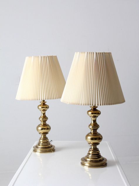 "This is a pair of vintage Stiffel brass table lamps.  The classic baluster style lamps have their original pleated shades.   CONDITION In good, working condition with wear consistent with age and use.  Wiring as found.  MEASUREMENTS Height:  27.75\"  ..  70.5 cm Height to Finial:  27.5\"  ..  69.9 cm Height to Socket:  19.25\"  ..  48.9 cm Base Diameter:  6.5\"  ..  16.5 cm Shade Diameter:  16\"  ..  40.6 cm 423121" Vintage Inspired Interior, Brass Lamp Styling, Vintage Gold Lamp, Vintage Pleated Lamp Shade, Stiffel Lamps Vintage, Brass Bedside Lamp, Stiffel Brass Lamps Vintage, Cute Vintage Lamps, Antique Brass Lamp