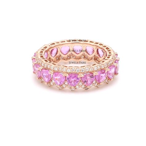 Pink sapphire heart eternity band ring 14K gold | Natural 4MM pink sapphire heart diamond ring gold | Pink wedding ring birthstone ring gold GEMSTONE DETAILS : ✦ Gemstone : Pink Sapphire ✦ Gemstone Type : Natural ✦ Gemstone Size : 4 MM ✦ Gemstone Shape : Heart Cut ✦ Number of Gemstones : 20 ✦ Gemstone Weight : 5-6 carats ✦ Gemstone Grade : AAA DIAMOND DETAILS : ✦ Diamond Type : Natural ✦ Diamond Size : 1.00 mm ✦ Diamond Color : F-G ✦ Diamond Clarity : Slightly included ✦ Diamond Cut : Excellent Pink Ring Aesthetic, Pink Wedding Ring, Gold Pink Wedding, Pink Rings, Heart Diamond Ring, Pink Wedding Rings, Diamond Ring Gold, Diamond Heart Ring, Ring Birthstone