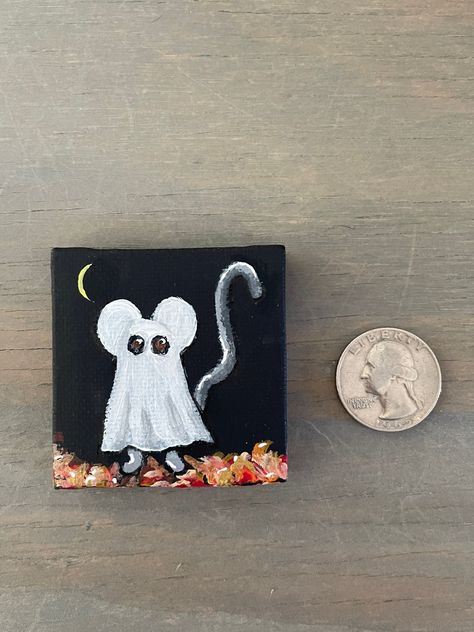 Trick or treat! Fun and festive painting of a mouse in a classic ghost costume...perfect for Autumn and Halloween.  This is an original, signed acrylic painting.   PLEASE NOTE: Easel can be added on by selecting drop down box and choosing "Paintings + easel."  This mini art would add a sweet accent to any room, tablescape, or mantelscape. What a fun gift for the Halloween lover or party host! The mouse painting is  2 inches by 2 inches and would be cute displayed on a shelf, ledge or in a china Trick Or Treat Artwork, Easy Painting Ideas For Halloween, Mini Halloween Canvas Paintings, Mini Canvas Halloween Art, Cute Halloween Painting Ideas, Little Ghost Painting, Cute Halloween Paintings, Ghost Portrait, Halloween Canvas Paintings