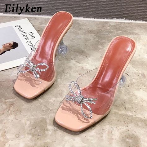 Brand Name: EilykenShoes Type: SlidesOrigin: CN(Origin)Upper Material: PVCHeel Type: Strange StyleOutsole Material: RubberHeel Height: Super High (8cm-up)With Platforms: YesPlatform Height: 0-3cmInsole Material: PUPattern Type: SolidSeason: SummerApplicable Place: OutsideItem Type: SlippersFit: Fits true to size, take your normal sizeModel Number: V5Fashion Element: CRYSTALDepartment Name: AdultLining Material: NONEslippers women: zapatos de mujerslides: sapatos das mulhereswomen slippers: femme Glass Heels, Transparent Heels, Sun Flowers, Slippers Summer, High Heel Slippers, High Heel Mules, Heeled Mules Sandals, High Heels Sandals, Pu Heels