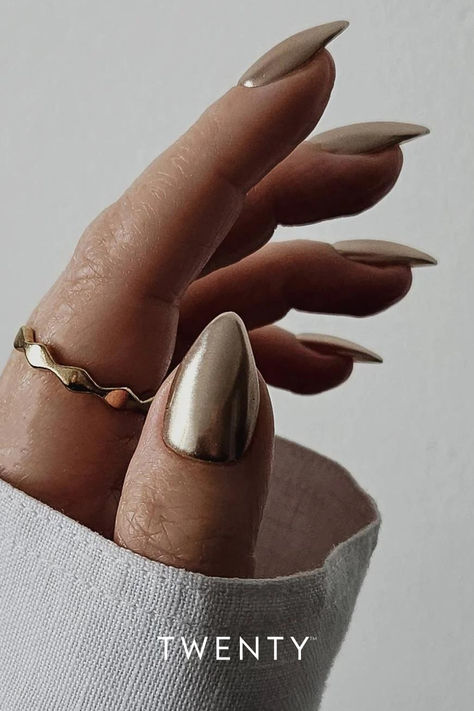 A close up of a hand with almond shaped nails with rose gold chrome nail art. Mirror Nail Polish, Gel Polish Nail Designs, Gold Chrome Nails, Rose Gold Chrome, Milky Nails, Chrome Nail Powder, Chrome Nails Designs, Gold Nail Designs, Cat Eye Gel Polish