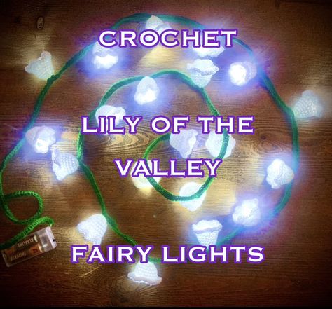 A string of fairy lights that have crocheted around to make it resemble lily of the valley, arranged in a spiral shape. Text over the top reads crochet Lily of the valley fairy lights. Lily Of The Valley Lights Crochet, Crocheted Fairy Lights, Crochet Fairy Lights Free Pattern, Lily Of The Valley Crochet Lights, Crochet String Lights, Crochet Fairy Lights, Lily Of The Valley Fairy, Lily Of The Valley Crochet, Flower Fairy Lights