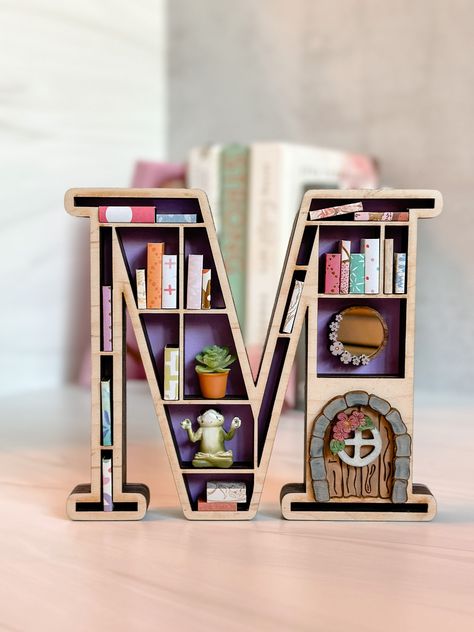 Excited to share this item from my #etsy shop: Mini Bookshelf, 3-D Wood Mini Bookshelf, Letter Bookshelf, Book Lover Gift, Mini Books, Book Lover, Book Lover Wall Decor, Laser Cut #letterbookshelf #bookwalldecor #booklovergift #homedecor #3dbookminibooks #3dbookshelf #teachergift #giftforreader #booklovegift Book Gifting Ideas, Cricut Book Projects, Mini Bookcase Diy, Mini Book Library, Creative Book Display, Diy Book End, Mini Bookshelf Diy, Book Nook Ideas Diy, Diy Mini Books