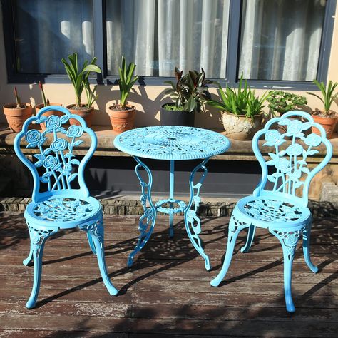 PRICES MAY VARY. ✔DURABLE CAST ALUMINUM: Made of solid cast aluminum that resists rust and weathering, helping to ensure a sturdy suit for years to come ✔Fits Most Places: 3 Piece Bistro Set Includes a Compact Table and 2 Comfortable Chairs, Perfect for Your Patio, Balcony, Porch, Garden or Backyard ✔Decorative Floral Designs: Rosette details and antique finishes adorn the table and each chair, creating a beautiful set that adds bold, lively glamour to any setting ✔Product Dimensions: Table Dime Colorful Patio Furniture, Bistro Patio Set, Vintage Outdoor Furniture, Compact Table, Bistro Table Set, Blue Patio, 3 Piece Bistro Set, Apartment Dining, Bistro Table Outdoor