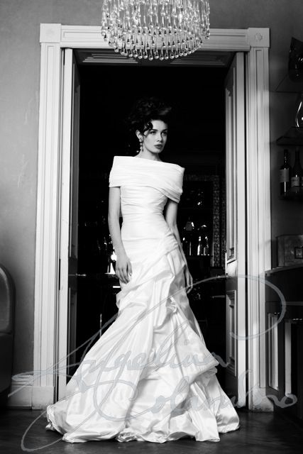 Couture bridal designer Angelina Colarusso, renowned for elegance and glamour, outstanding corsetry, timeless design and signature 1950s body draping . Each gown capturing the very spirit of vintage silver screen and the timeless elegance of the worlds most unforgettable women. The dramatic and sophisticated Mira wedding dress by couture bridal designer Angelina Colarusso. #offtheshoulderweddingdress #corsetedweddingdress #weddingdresswithcorset #vintagestyleweddingdress #vintagehollywoodstyle Angelina Colarusso, Italian Wedding Dress, Wedding Dresses London, A Wedding Dress, Wedding Dress Couture, Couture Wedding, Mermaid Fashion, Elegant Wedding Dress, Bridal Designs