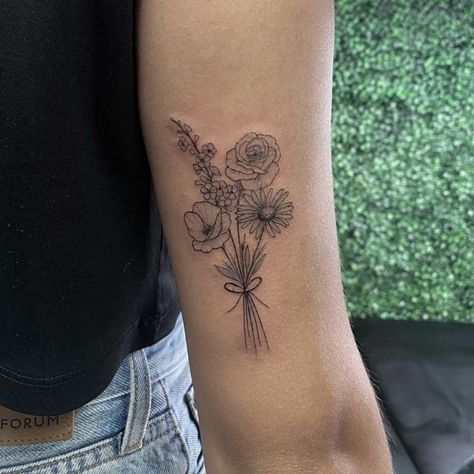 Floral bouquet tattoo | Artist: Tamia Overes Bouquet Of 4 Flowers Tattoo, Tattoo Flowers Bouquet, Bouquet Of Different Flowers Tattoo, Family Boquet Tattoos, Line Work Flower Bouquet Tattoo, Small Boquetes Of Flowers Tatoos, Flower Bouquet Tattoo Upper Arm, Bouquet Of Flowers Tattoo Birth Month, Tattoo Ideas Flower Bouquet