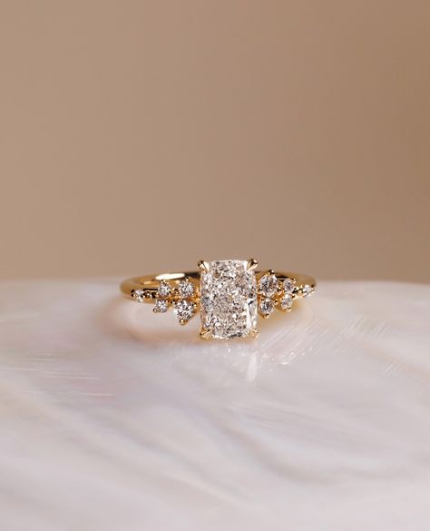 Elongated Cushion with accent stones? YES PLEASE✨⁠
⁠
The gorgeous Winnie engagement ring💍⁠
⁠
Would you say yes to this beauty? ⁠
⁠
Details:⁠
Winnie - Elongated Cushion with Accent Stones
1.50cts | E | VVS2 Wedding Rings Elongated Cushion, Elongated Cushion With Side Stones, Cushion Engagement Ring Gold, Elongated Cushion Engagement Ring, Ring Cuts, Most Popular Engagement Rings, Ring Inspo, Popular Engagement Rings, Elongated Cushion