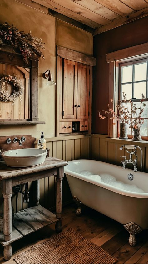 Discover charming ideas to add a rustic touch to your bathroom decor. Explore cozy and inviting designs that bring warmth and character to your space. From reclaimed wood accents to vintage fixtures, these rustic bathroom decor inspirations will create a relaxing retreat in your home. Embrace the timeless beauty of natural elements and earthy tones for a serene atmosphere in your bathroom. Copper And Wood Bathroom, Tiny Cabin Bathroom Ideas, Country Farm Bathroom, Early American Bathroom, Rustic Sink Bathroom, Moody Rustic Bathroom, Mountain Bathroom Decor, Vintage Cabin Bathroom, Vintage Western Bathroom