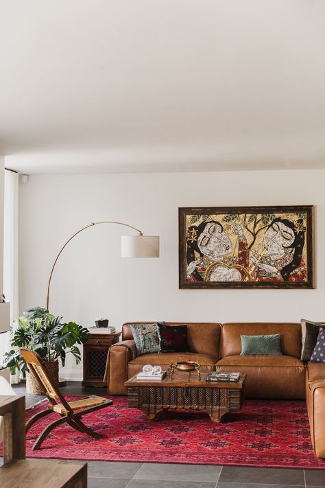 Living room with arch lamp leather couch persian rug Indian inspired home in the Glebe Ottawa Ontario Studio-Kahaani-Ottawa-interior-design-inspiration-ideas-brand-photos-by-Sonia-V-Photography Red Rug Leather Couch, Sofa With Chairs Layout, Leather Couch Persian Rug, Styled Leather Couch, Adobe Style Living Room, Living Room Inspiration Persian Rug, Apartment With Dark Floors, Indian Inspired Modern Home, Mcm Living Room Persian Rug