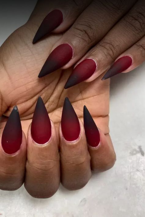 Get a stylish edgy twist with these stunning red & black almond nails. This unique nail design is perfect for making a bold statement and adding some attitude to your look. Whether you’re going for a night out or just want to express your individuality, these nails will definitely turn heads. The combination of the vibrant red and sleek black colors creates a striking contrast that is sure to make you stand out. Elevate your manicure game with these fierce and sophisticated almond nails today! Red And Black Witch Nails, Black To Red Gradient Nails, Red To Black Nails Ombre, Red And Black Vampire Nails, Red Oval Nails Designs, Blood Tipped Nails, Hades And Persephone Inspired Nails, Black And Red Nails Design Ideas, Gel Nail Color Combinations