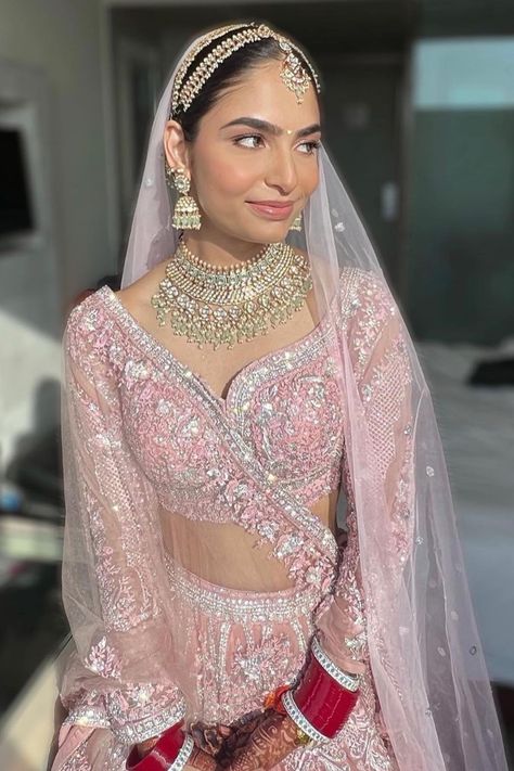 The minimal makeup, pastel pink lehenga & a hint of red bridal chooda to make it pop
- we are pinning this bridal inspiration right away! When it comes to wedding lehengas, red has always been a favourite with brides. But off late, brides are giving the traditional red lehenga a miss and opting for a different and unique hue when it comes to picking up their bridal lehenga – powder pink! A pale shade of pink that is in the pastel family has been a bridal favourite off late for your wedding day. Manushi Chiller In Prithviraj, Light Pink Wedding Lengha, Pastel Bridal Jewellery, Pale Pink Lehenga, Minimal Chooda, Light Pink Lehenga Jewellery Ideas, Baby Pink Lehenga Bridal, Pastel Pink Lehenga Bridal, Jewellery With Pink Lehenga