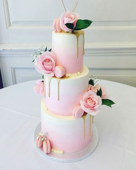 Three tier wedding cake with soft pink ombré, gold drip, macarons and fresh flowers / foliage Pink And Gold Two Tier Cake, Pink Three Tier Cake, Wedding Cake With Macarons And Flowers, Pink 2 Tier Birthday Cake, Three Tier Wedding Cake With Flowers, Birthday Cake Three Tier, Tiered Drip Cake, 2 Tier Pink Cake, Two Tier Drip Cake