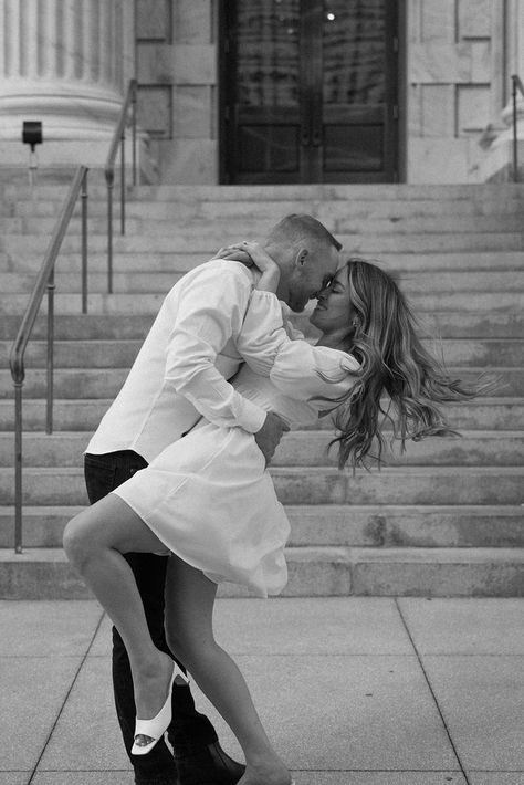 Editorial engagement photoshoot in downtown Tampa. The bride wears a short white bridal dress and the groom wears classic black pants and a white dress shirt Engagement Photoshoot Ideas Editorial, Engagment Shoot Dress, Short Wedding Dress Poses, Engagement Street Photography, Engagement Photoshoot Ideas Charleston, Women Engagement Outfits, Engagement Photo Elegant, Italian Style Engagement Photos, Short Dress Wedding Photos