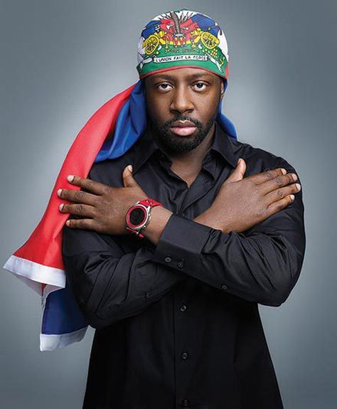 Wyclef Jean (wearing the Haitian flag), Haitian rapper, singer-songwriter… Wyclef Jean, Haiti Flag, Haitian Flag, Kodak Black, American Rappers, Record Producer, Shades Of Black, Haiti, Rappers