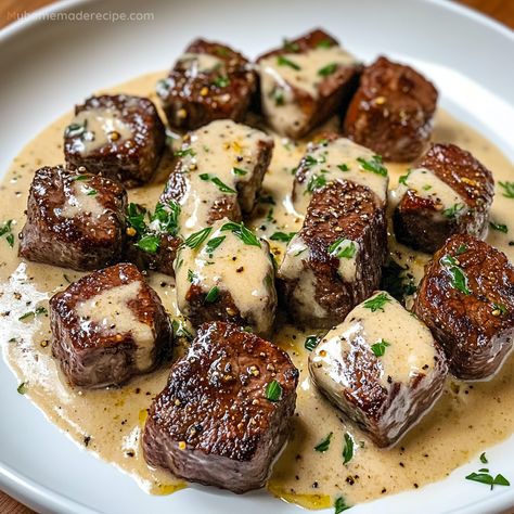 Garlic Butter Steak Bites paired with a luscious Parmesan cream sauce make a savory and satisfying dinner. Ready in just 25 minutes! Steak Bites Cream Sauce, Steak And Cream Sauce, Garlic Butter Steak Dinner, Steak In Garlic Butter Sauce, Steak Bites With Dipping Sauce, Dinner Ideas Steak Bites, Garlic Butter Steak Bites With Parmesan Cheese Sauce, Steak With Garlic Butter Sauce, The Best Steak Recipes