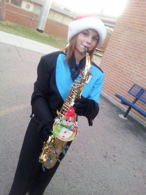 Her decorations for Parade of Lights Marching Band Christmas Parade, Christmas Instruments, Marching Band Aesthetic Saxophone, Marching Band Ornaments, Marching Band Aesthetic Trombone, Low Brass Marching Band, Band Christmas, Marching Band Pit Memes, Kid Christmas